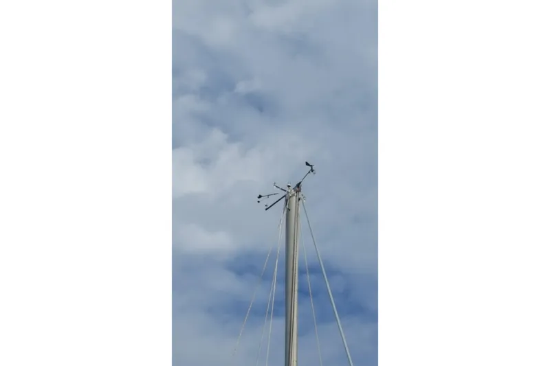 Slide: The Image of Mast of 1973 Bristol 40 sailboat against cloudy sky. - 8