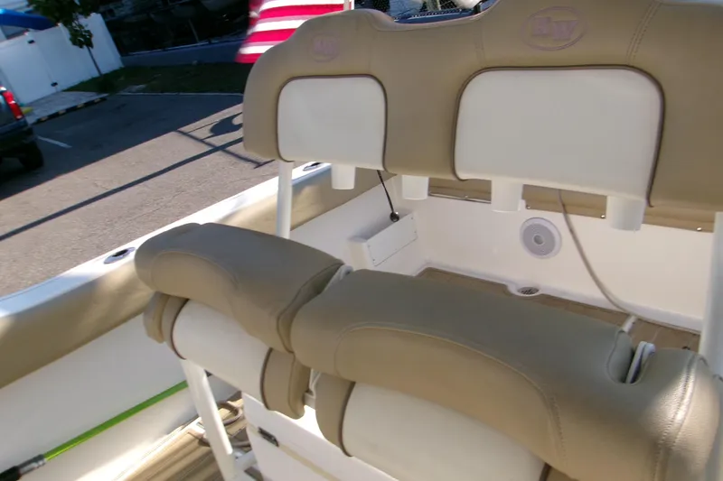 Slide: The Image of 2020 Key West 239 FS boat interior with tan and white seating. - 13