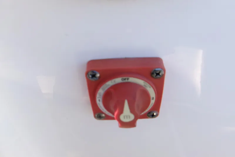 Slide: The Image of Red switch on a 2020 Key West 239 FS boat, mounted on a white surface. - 16