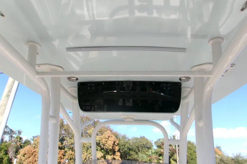 Slide: The Image of 2020 Key West 239 FS boat T-top interior view with clear sky background. - 17