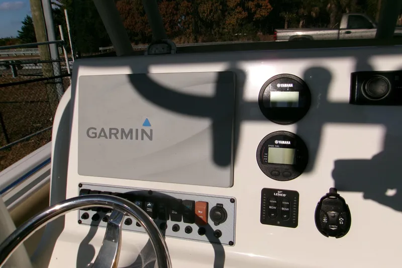 Slide: The Image of 2020 Key West 239 FS boat dashboard with Garmin and Yamaha displays. - 6