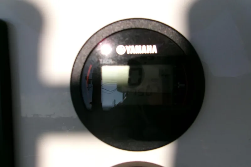 Slide: The Image of Yamaha tachometer on 2020 Key West 239 FS boat dashboard, displaying engine RPM. - 7