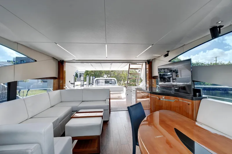 Slide: The Image of Luxurious interior of 2017 Sunseeker 68 Sport Yacht with modern furnishings and large windows. - 15