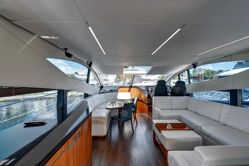 Slide: The Image of Luxurious interior of 2017 Sunseeker 68 Sport Yacht with modern seating and panoramic windows. - 16