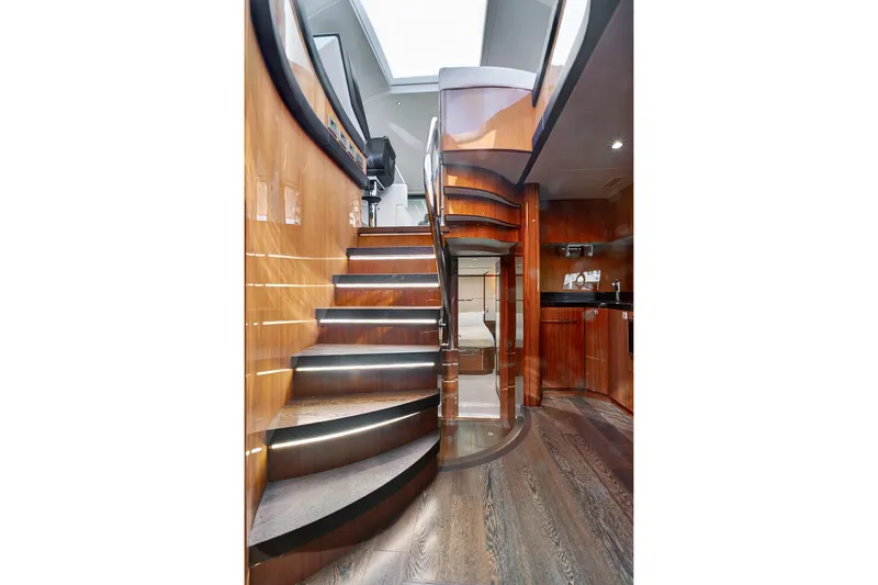 Slide: The Image of Luxurious interior of 2017 Sunseeker 68 Sport Yacht with elegant wooden staircase. - 21