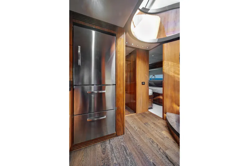 Slide: The Image of Luxurious interior of 2017 Sunseeker 68 Sport Yacht with modern wood finishes and stainless steel appliances. - 23