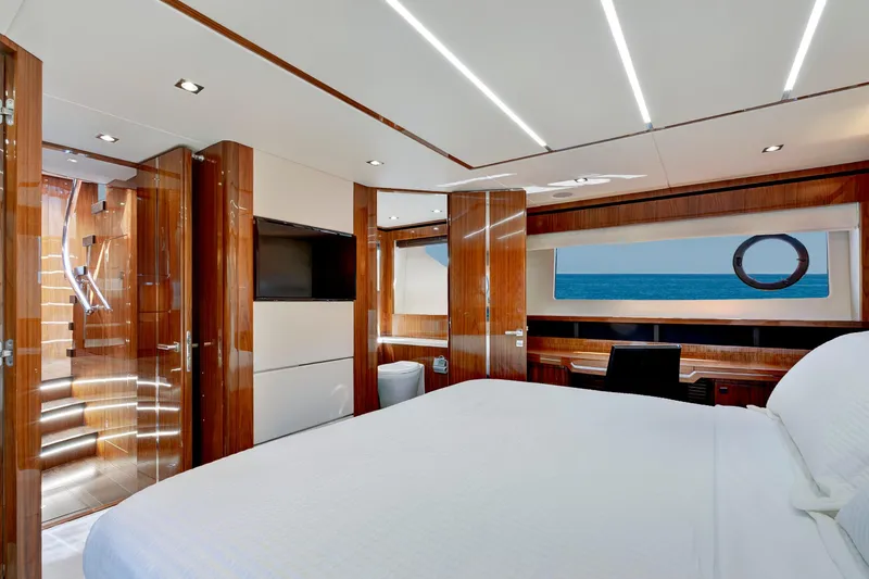 Slide: The Image of Luxurious interior of 2017 Sunseeker 68 Sport Yacht with elegant wood finishes and ocean view. - 25