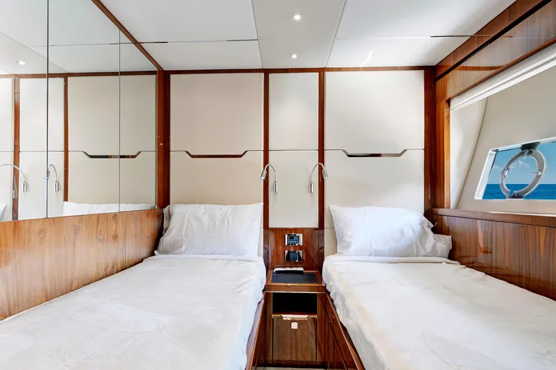 Slide: The Image of Luxurious twin cabin in 2017 Sunseeker 68 Sport Yacht, featuring elegant wood paneling. - 34