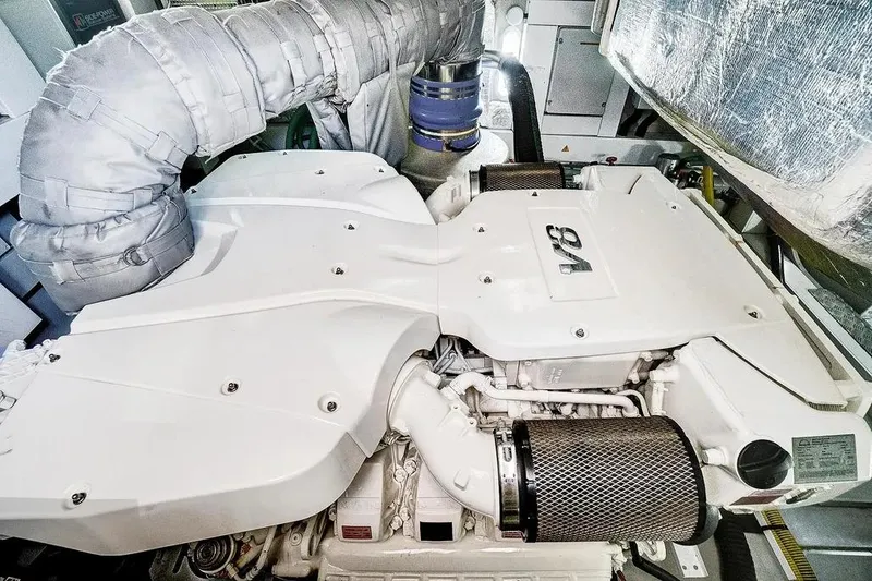 Slide: The Image of Engine room of 2017 Sunseeker 68 Sport Yacht showcasing powerful V8 engine. - 37