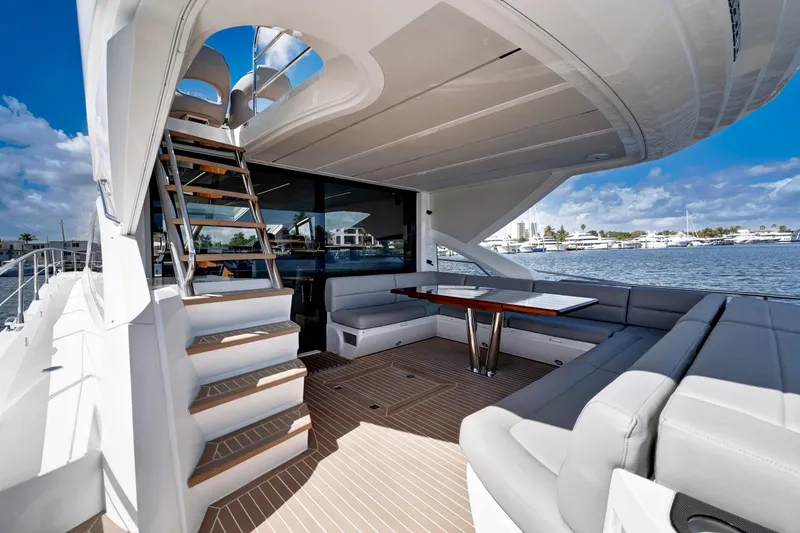 Slide: The Image of Luxurious 2017 Sunseeker 68 Sport Yacht with spacious deck and elegant seating area. - 7