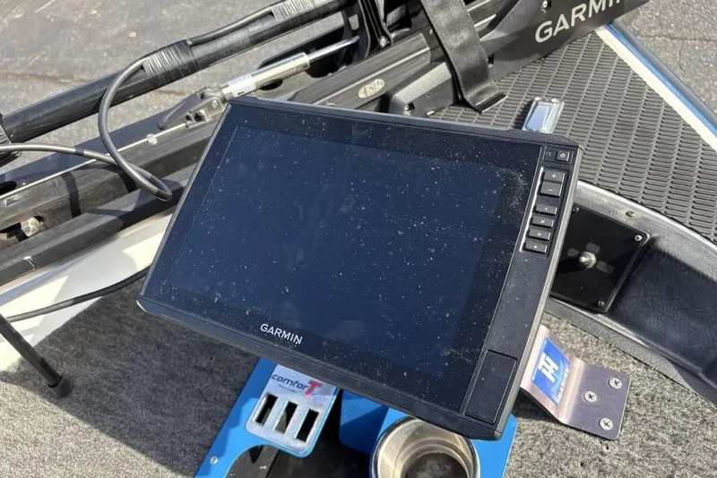 Slide: The Image of Garmin device on 1997 Javelin 400 SE boat dashboard, featuring control buttons and wiring. - 10