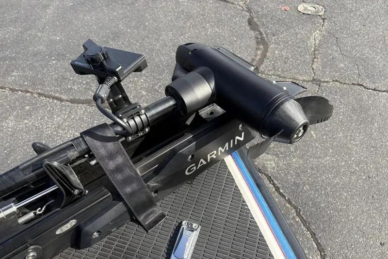 Slide: The Image of Garmin trolling motor mounted on a 1997 Javelin 400 SE boat, on a textured surface. - 11