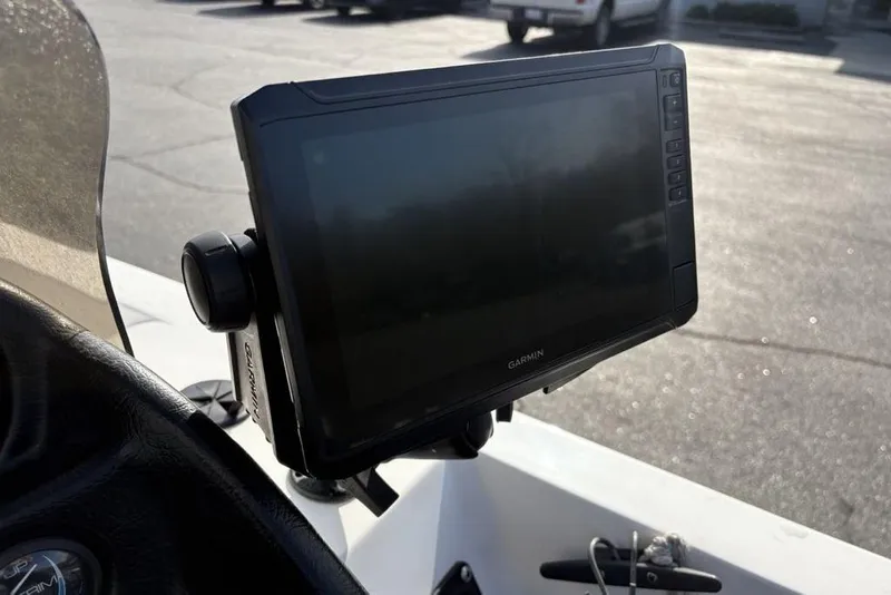 Slide: The Image of Garmin GPS device mounted on a 1997 Javelin 400 SE boat dashboard. - 25