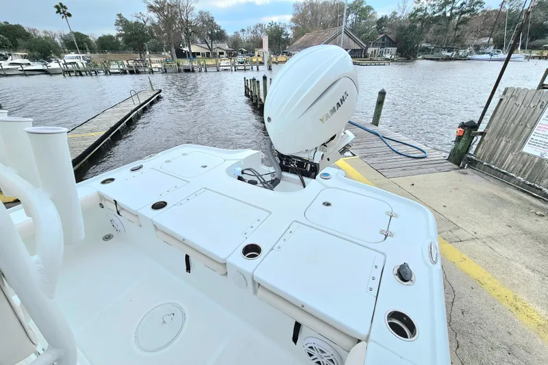 Slide: The Image of 2026 Sea Hunt BX 22 BR boat with Yamaha engine at a dockside location. - 11