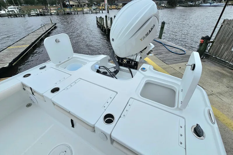 Slide: The Image of 2026 Sea Hunt BX 22 BR boat with Yamaha engine at dockside. - 12