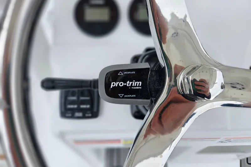 Slide: The Image of Close-up of 2026 Sea Hunt BX 22 BR steering wheel with Pro-Trim control. - 22