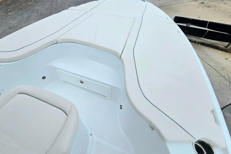 Slide: The Image of 2026 Sea Hunt BX 22 BR boat interior with white cushioned seating. - 23