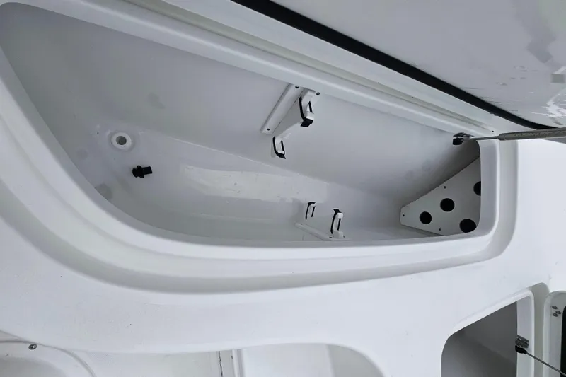 Slide: The Image of 2026 Sea Hunt BX 22 BR boat storage compartment, open and empty. - 25