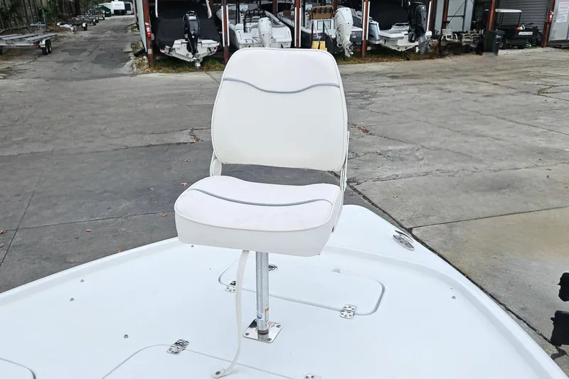 Slide: The Image of 2026 Sea Hunt BX 22 BR boat with a white swivel seat on deck. - 31