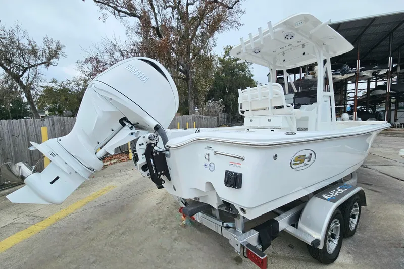 Slide: The Image of 2026 Sea Hunt BX 22 BR boat with Yamaha outboard motor on a trailer. - 6