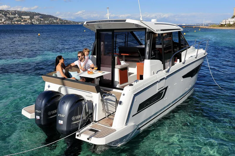 Slide: The Image of 2019 Jeanneau NC 895 interior with built-in microwave in wooden cabinet. - 6