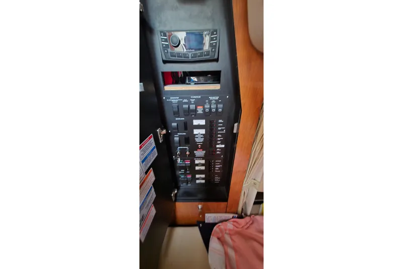 Slide: The Image of Electrical control panel inside 2007 Sea Ray 340 Sundancer boat cabin. - 18