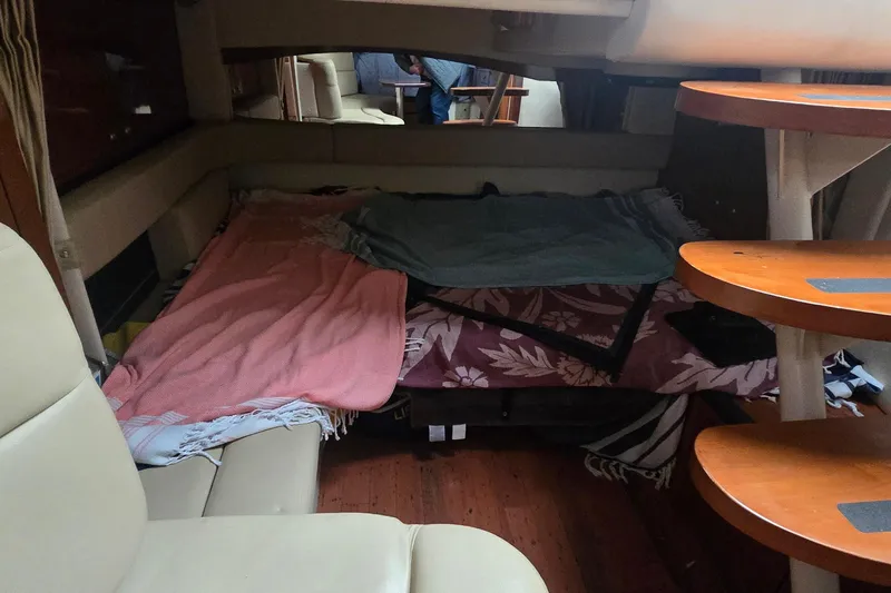 Slide: The Image of Interior cabin of 2007 Sea Ray 340 Sundancer with cozy sleeping area and wooden steps. - 19