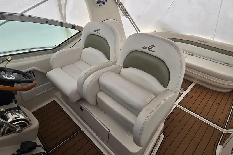 Slide: The Image of Luxury cockpit seating on 2007 Sea Ray 340 Sundancer with wood-style flooring. - 6