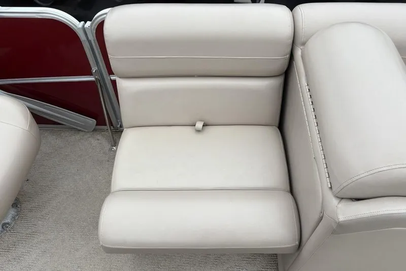 Slide: The Image of 2013 Berkshire 233 RFX STS boat seat with beige upholstery and red paneling. - 20