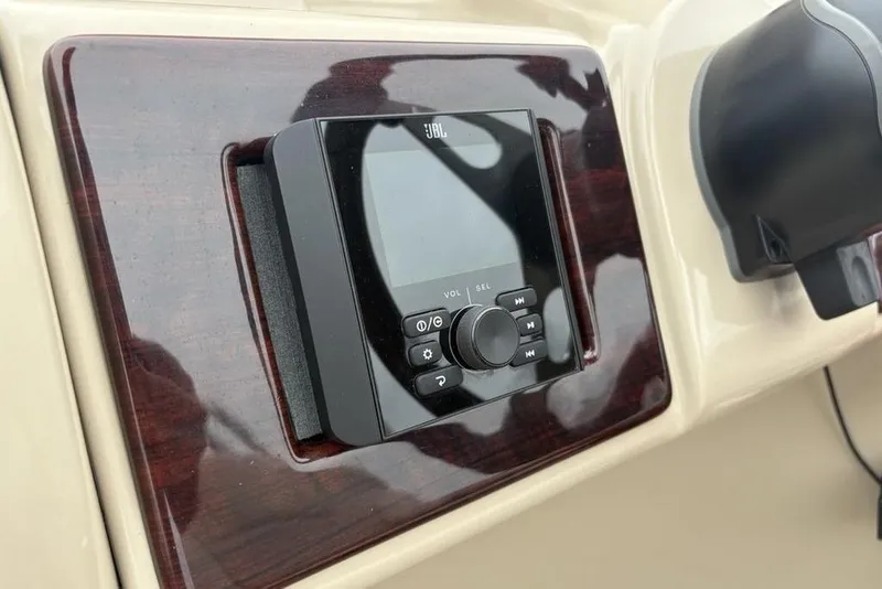 Slide: The Image of JBL audio system on 2013 Berkshire 233 RFX STS boat dashboard. - 28