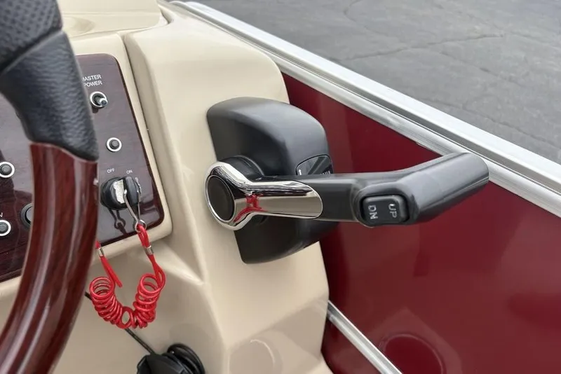 Slide: The Image of Control panel of 2013 Berkshire 233 RFX STS boat with throttle lever. - 30