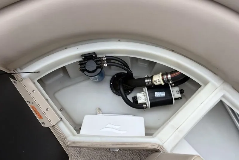 Slide: The Image of Storage compartment of a 2013 Berkshire 233 RFX STS boat, showing internal components. - 33
