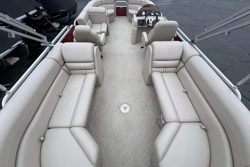 Slide: The Image of 2013 Berkshire 233 RFX STS pontoon boat with spacious beige seating and modern helm. - 38
