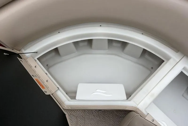 Slide: The Image of 2013 Berkshire 233 RFX STS boat storage compartment with open lid, showcasing interior space. - 6
