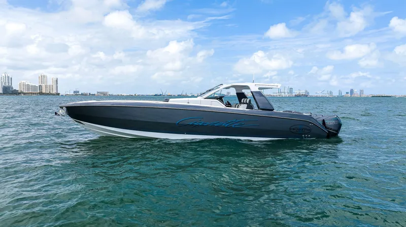 The Image of 2022 Cigarette 42 Auroris boat on open water under blue sky. - 0