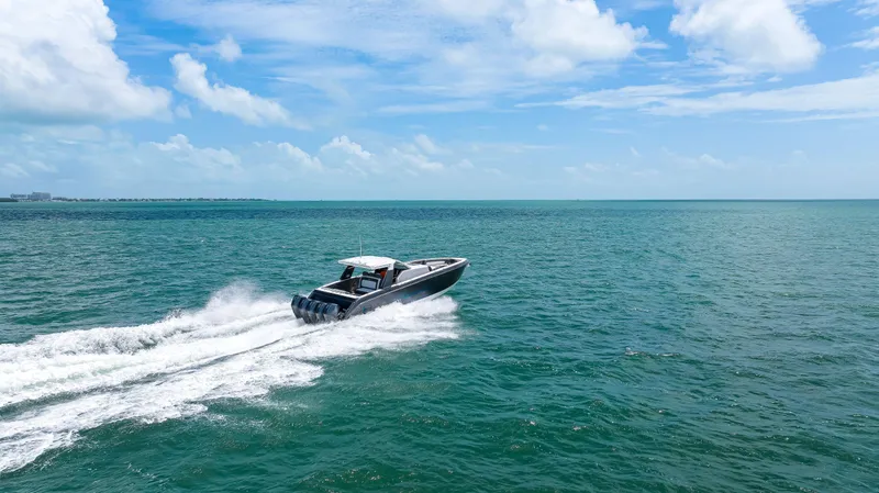 Slide: The Image of 2022 Cigarette 42 Auroris speedboat cruising on open ocean under blue sky. - 16