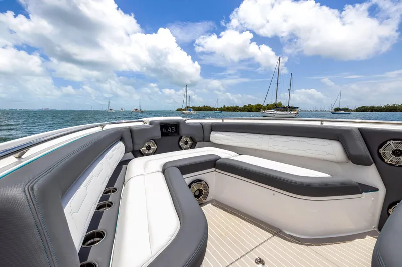 Slide: The Image of Luxurious seating on 2022 Cigarette 42 Auroris boat, with ocean view and blue skies. - 19