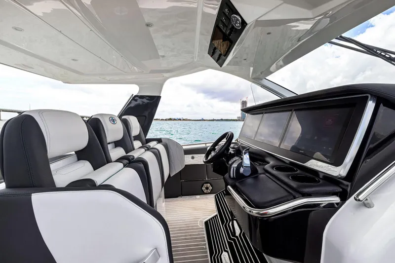 Slide: The Image of Interior of 2022 Cigarette 42 Auroris boat with luxury seating and modern dashboard. - 26