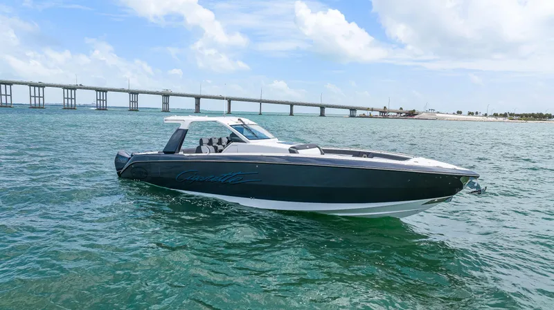 Slide: The Image of 2022 Cigarette 42 Auroris boat on open water near a bridge. - 3