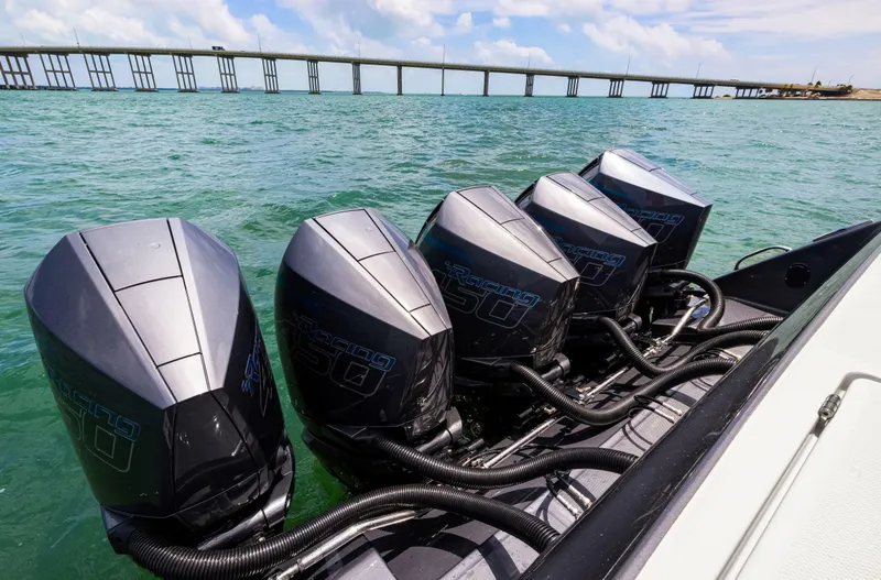 Slide: The Image of 2022 Cigarette 42 Auroris boat with five powerful outboard engines on the water. - 34