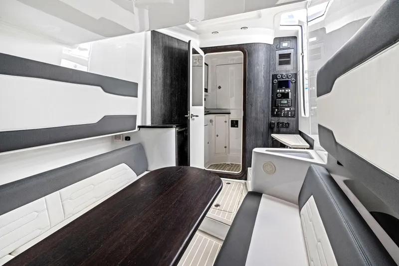 Slide: The Image of Luxurious interior of 2022 Cigarette 42 Auroris boat with modern seating and control panel. - 42