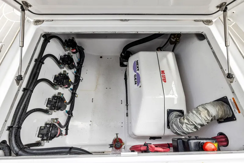 Slide: The Image of 2022 Cigarette 42 Auroris engine compartment with wiring and components. - 47