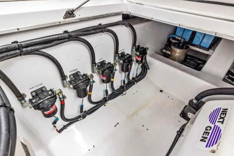 Slide: The Image of Engine compartment of 2022 Cigarette 42 Auroris boat, showcasing fuel system and wiring. - 48