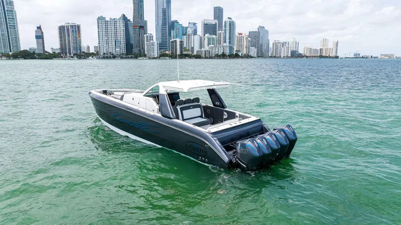 Slide: The Image of 2022 Cigarette 42 Auroris boat on water with city skyline in background. - 6