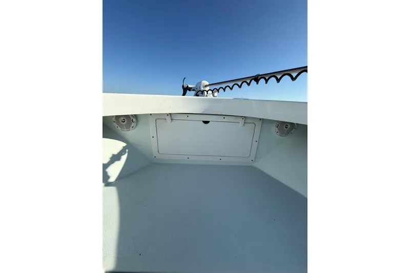 Slide: The Image of 1987 Privateer 22 Roamer boat interior with clear blue sky background. - 13