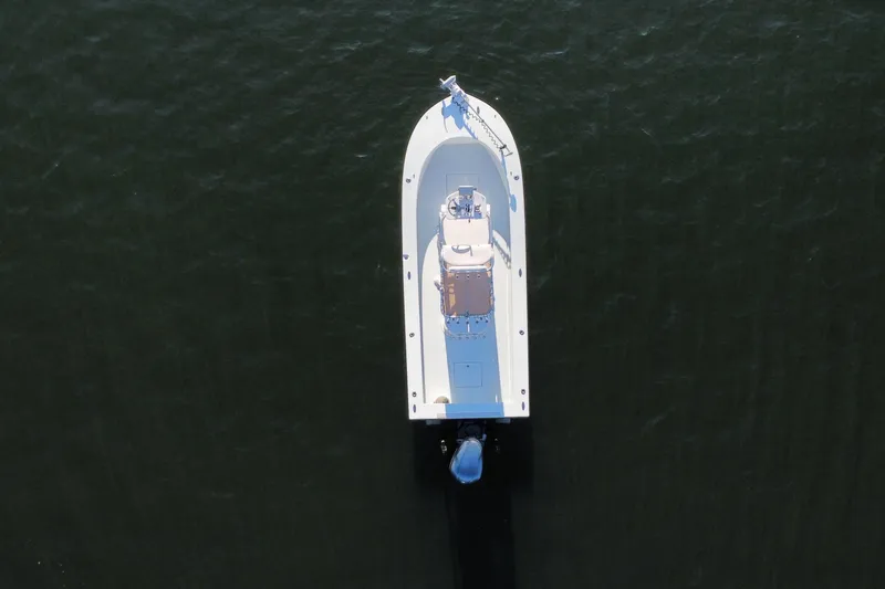 Slide: The Image of Aerial view of 1987 Privateer 22 Roamer boat on dark water. - 5