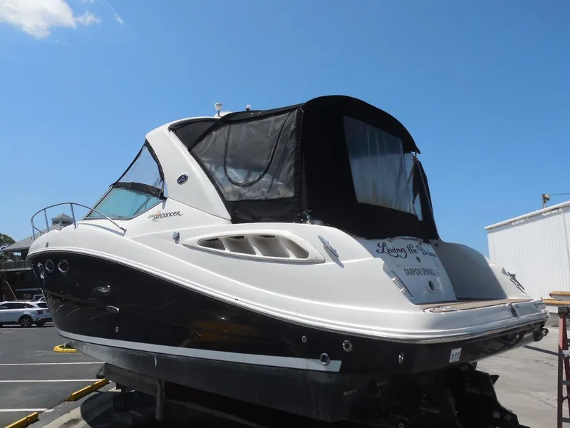 The Image of 2007 Sea Ray 290 Sundancer boat on display under clear blue sky. - 0
