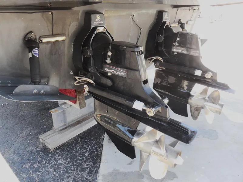 Slide: The Image of 2007 Sea Ray 290 Sundancer with dual MerCruiser outdrives, docked on a stand. - 12