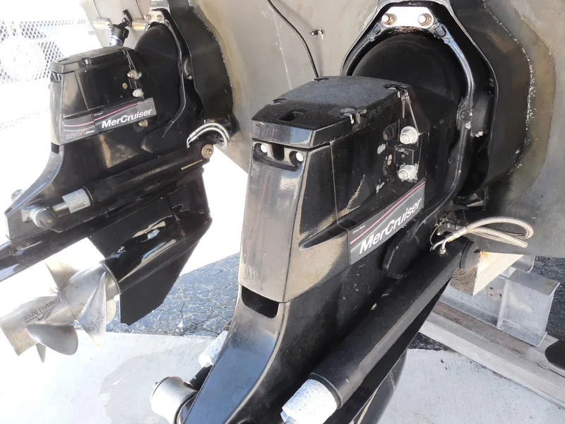 Slide: The Image of MerCruiser outdrives on a 2007 Sea Ray 290 Sundancer boat, showcasing dual propellers. - 13