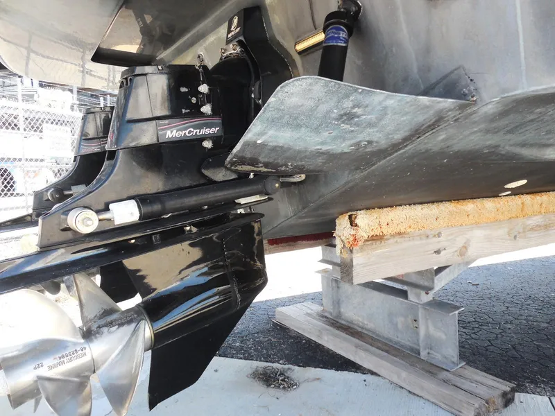 Slide: The Image of 2007 Sea Ray 290 Sundancer with MerCruiser engine, showing propeller and stern drive details. - 14